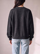 Worn by a woman: Crewneck Sweater, from the back