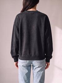 Worn by a woman: Crewneck Sweater, from the back