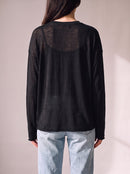 Worn by a woman: Her Sheer Long Sleeve, from the back