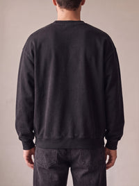 Worn by a man: Crewneck Sweater, from the back