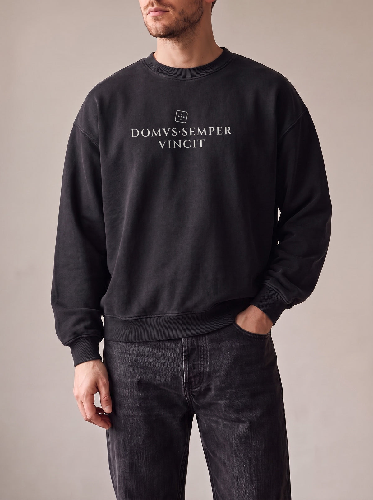 Worn by a man: Crewneck Sweater, DOMVS·SEMPER VINCIT on a washed black oversized crewneck sweatshirt