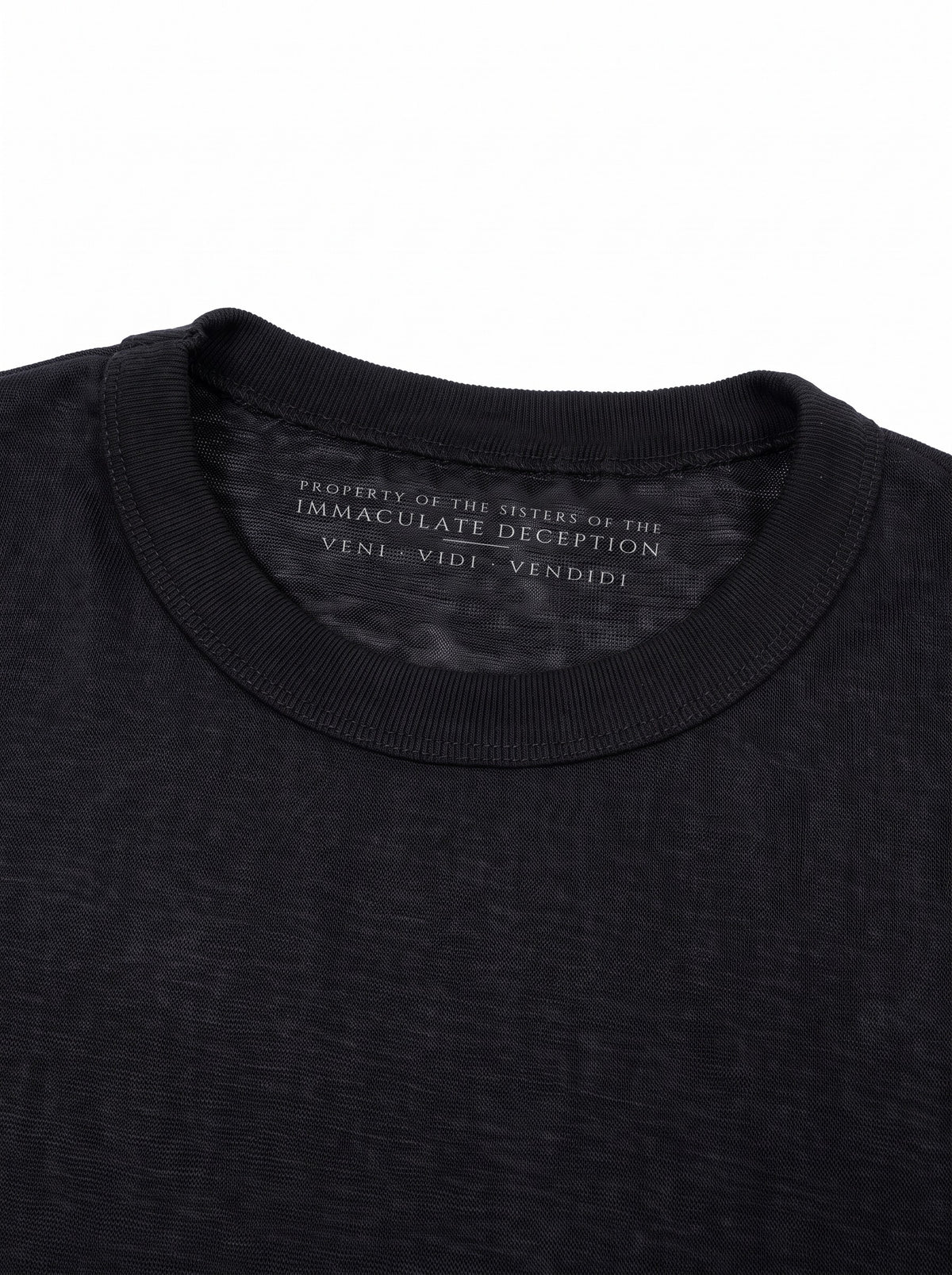 Worn by a woman: Her Sheer Long Sleeve, inside the collar: PROPERTY OF THE SISTERS OF THE IMMACULATE DECEPTION, VENI VIDI VENDIDI