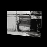 Annulments at full length as a glossy aluminum print floating off a black wall, with the board added for the website; the print ships uncensored